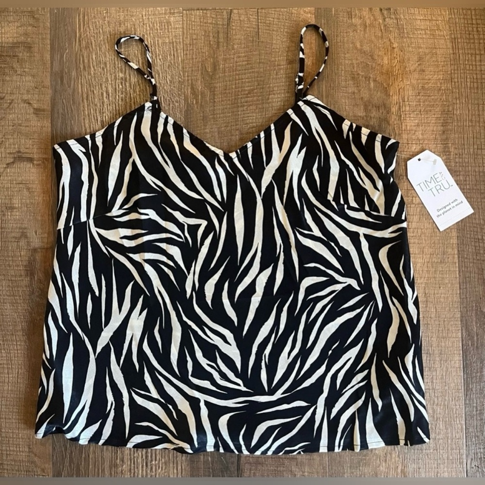Zebra print camisole. Features adjustable straps. New with tags. Size Small - Picture 3 of 7